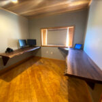 A unique office setup using walnut slabs for desks.