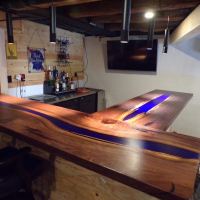 Black walnut with blue epoxy river bartop